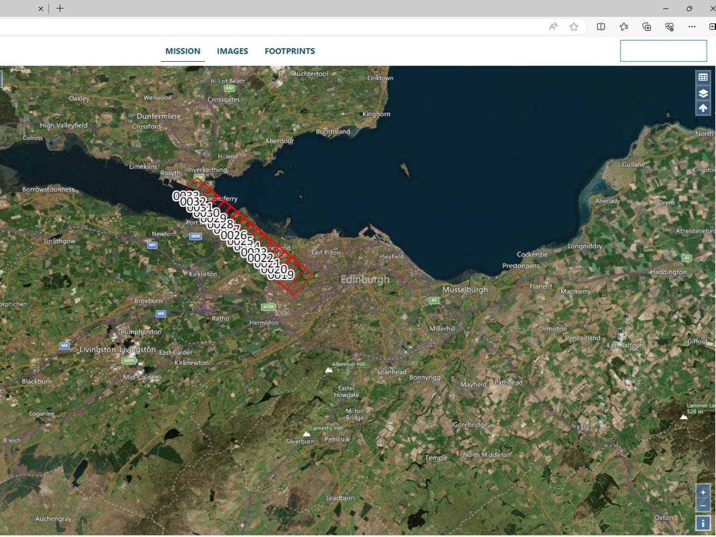 A screenshot of a satellite image of the Lothians and Fife, with green and brown fields, the city of Edinburgh in the middle and blue sea in the top right quarter. The same row of numbered, red digital boxes from the previous image is still visible.