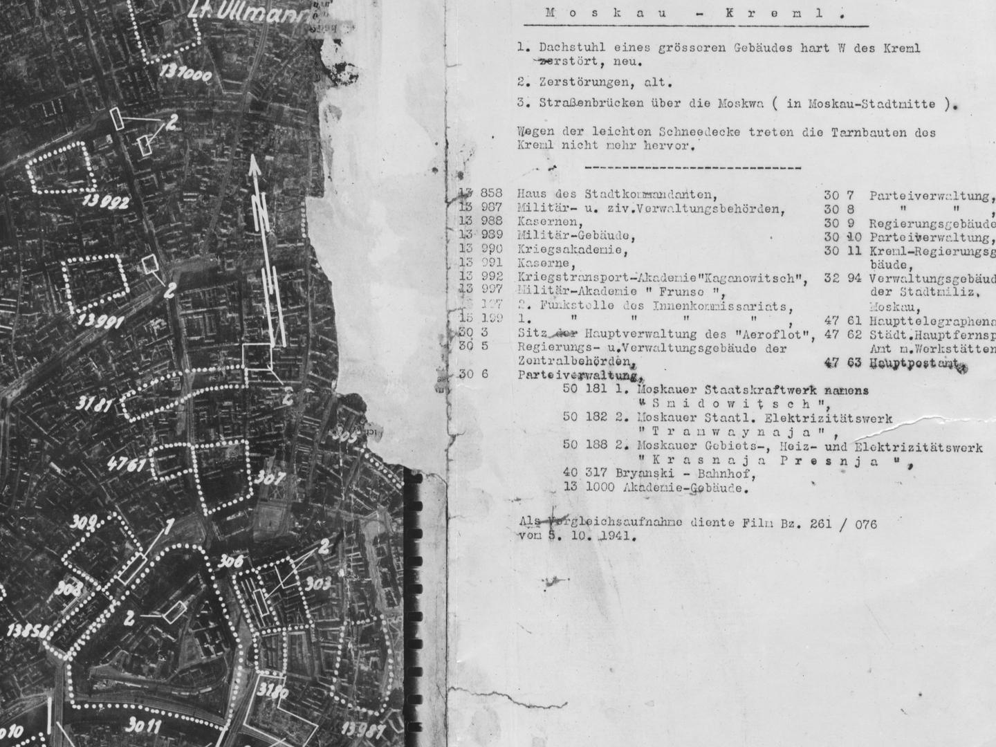 A black and white aerial photomap of a city, with a large amount of text in German to the right. The city has densely packed blocks of buildings. Some are marked with dotted lines and numbers, including a triangular area at the bottom marked ‘3011’.
