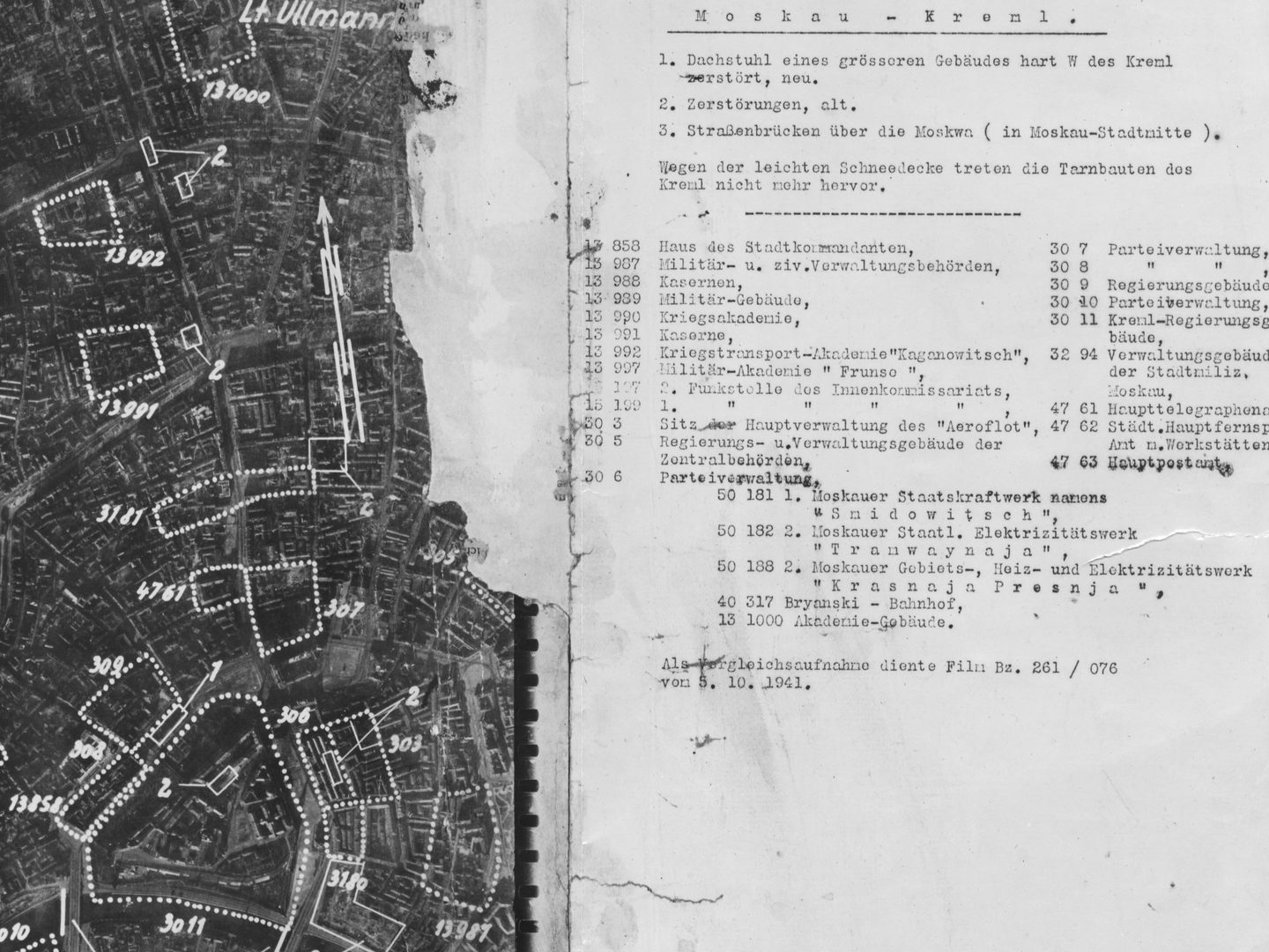 A black and white aerial photomap of a city, with a large amount of text in German to the right. The city has densely packed blocks of buildings. Some are marked with dotted lines and numbers, including a triangular area at the bottom marked ‘3011’.