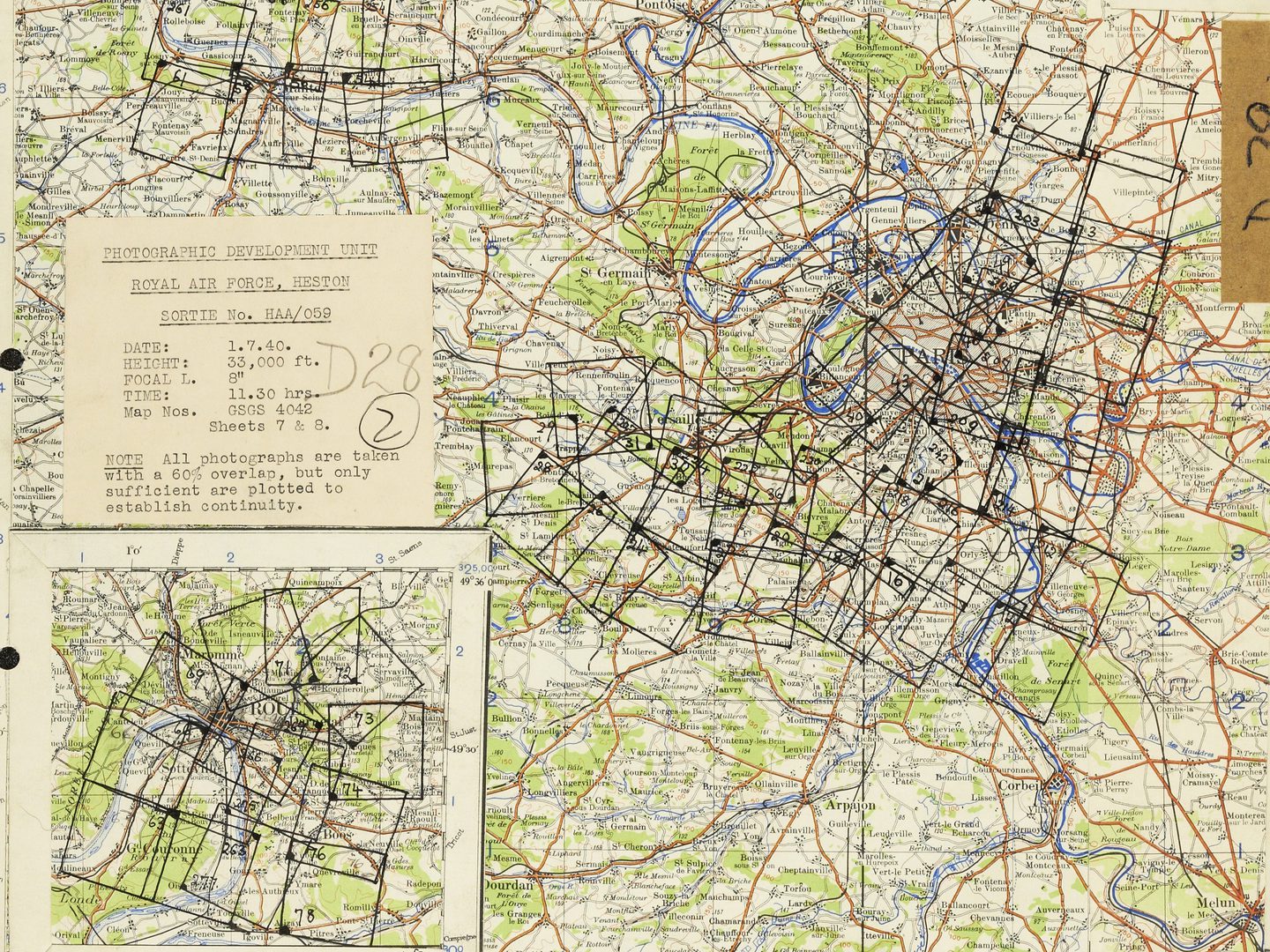 A colourful map of Paris, with blue representing water and green for woods. The map is covered with black boxes indicating where aerial photos were taken. There is an inset covering Rouen and a label with information about the reconnaissance sortie.