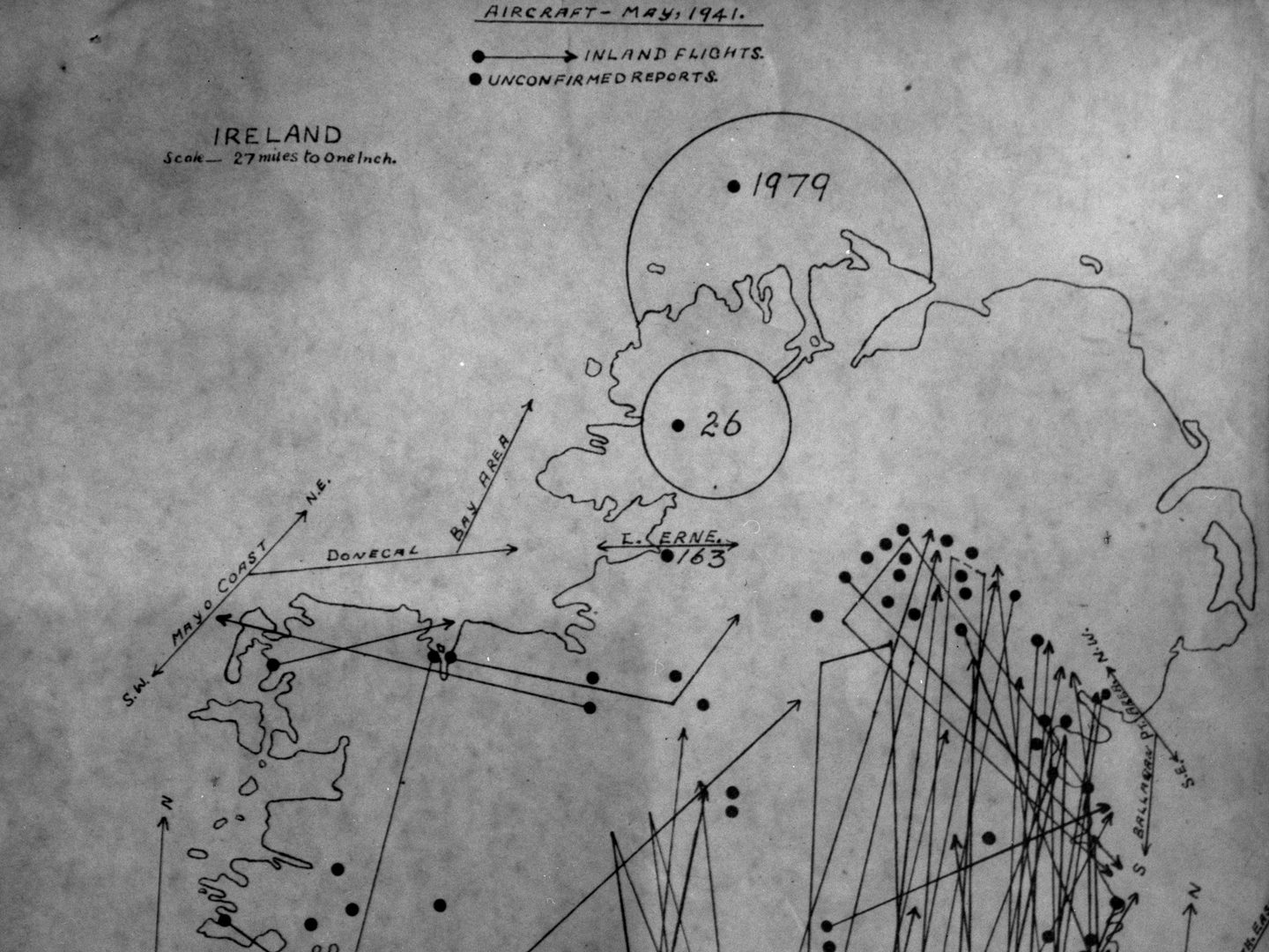A historic hand-drawn map of Northern Ireland and the north of the Republic of Ireland titled 'Aircraft May 1941'. Arrows and dots indicate the numerous occasions non-Irish aircraft were reported as flying over the country.