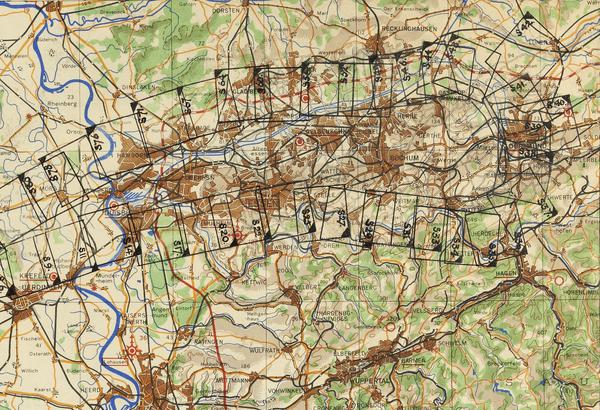 A colourful map of Bochum in Germany, with blue representing water, brown representing built-up areas and green representing countryside. 2 straggling lines of numbered black boxes indicate where a reconnaissance plane took photos.
